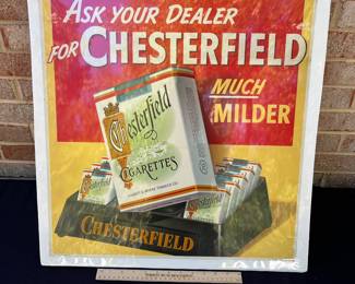 A12 - $125. Chesterfield Cigarettes Display Sign - Cardboard. Measures 21” x 22”. The sign has some rips and creases on the corners. It also has some rubbed off color near lettering. We did not take it out of sealed package to inspect the back.