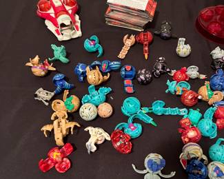 A227 - $150. Bakugan LOT with pieces & a box of cards.