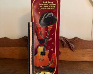 A212 - $25. Holly Jolly Rock Santa in box. Box measures 17 inches tall.