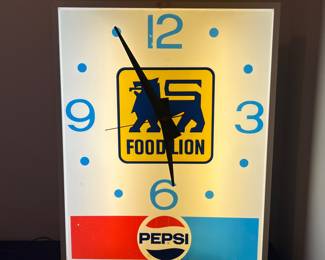 A147 - $400. Large Pepsi Advertising - Food Lion light up clock sign. Works great. Measures 24" x 4.5" x 30" tall.