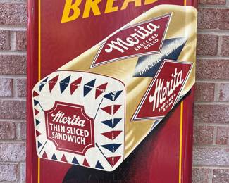 A64 - $1750. Merita Bread sign. Measures 54” by 18”. Bottom Right reads Stout Sign Co. St. Louis MO.