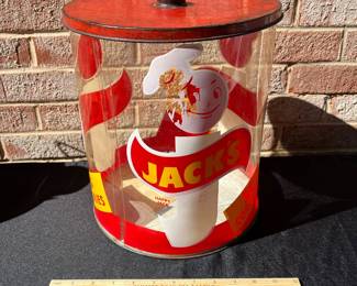 A73 - $65. 1950’s Jack’s 1 cent cookie jar. Measures 12" tall. Plastic with Metal Lid.