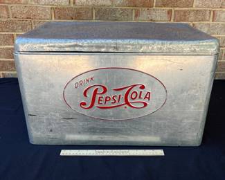 A105 - $125. 1950s Pepsi-Cola cooler. Measures 22“ x 13“.