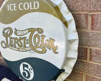 A15 - $50. Pepsi-Cola 5 cent metal sign. Measures 19” diameter. It has some rubbed off paint on corners and colors are faded. Otherwise in good, vintage shape.