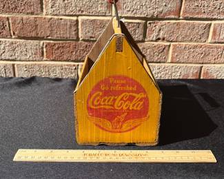 A85 - $55. Coca-Cola wood carrying case. Measures 8.25“ x 5.25”