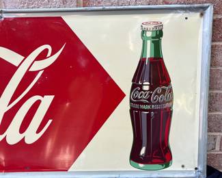A24 - $700. Coca-Cola Robertson metal 1940s-1950s sign. Measures 54” x 18”.