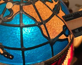 A146 - $115. 1976 Schlitz, beer lighted motion globe and clock. Show signs of age. Globe lights and rotates but clock is not working. Measures 14" x 9.5" tall..
