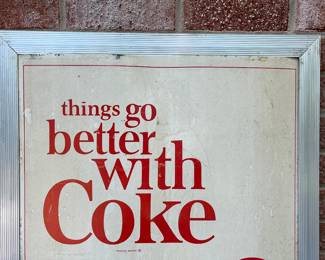 A26 - $85. 1970s Captain’s Navy Cap Coca-Cola sign. Measures 19” x 36”.
