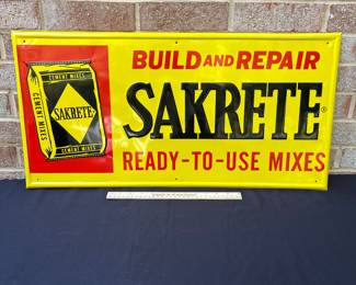 A61 - $20. Reproduction Sakrete embossed tin sign. Measures 28.5” by 14.25”.