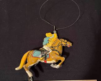 A170 - $50. 1930s MARX 10 wind up cowboy. Missing arm. Not working.