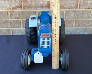 A97 - $50. Ford 8000 Tractor Toy. Measures 12“ x 8“. In good shape.