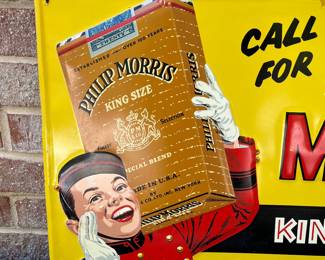 A13 - $550. Vintage Call for Philip Morris metal sign. Stout Sign Co. Measures 15” x 27”. The sign has some wear on the edges, and some scraped off paint. It has some rubbed off paint or rust right in the middle at the top of the sign.