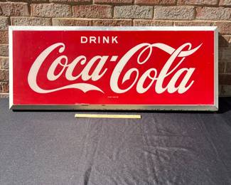 A34 - $275. Drink Coca-Cola Store Sign # 1 . Measures 40” x 16”.
