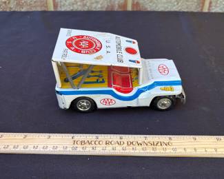 A101 - $60. AAA Automobile Club Tin Car. It has some small scratches.