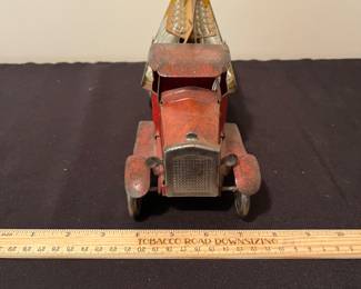 A171 - $150. 1931 Metalcraft Bottle Truck. Metal Wheels with 10 small glass bottles.