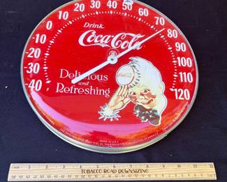 A50 - $30. Drink Coca-Cola "Sprite Guy" Thermometer 1984. Measures 12” diameter. Works!