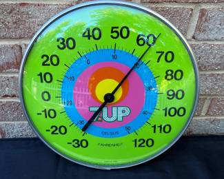 A31 - $100. 1970s 7-Up Thermometer. Measures 12.5 diameter.