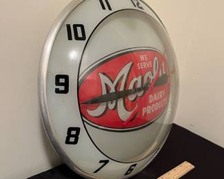 A151 - $400. 1950s Maola Dairy Products North Carolina bubble clock. Needs a new bulb. Clock works. Measures 16" diameter.