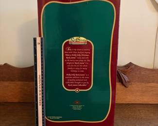 A212 - $25. Holly Jolly Rock Santa in box. Box measures 17 inches tall.