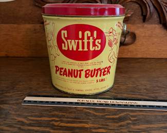 A203 - $20. Swift’s peanut butter 5 pound bucket. Measures 6.25 inches tall. Some dents and paint rubbed off. Otherwise good, used vintage shape.