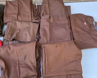 A155 - $60. Vintage Coca-Cola uniform clothing lot. Includes one jacket, one vest, seven pairs of pants. The jacket is in decent condition. Most of the pants have a stain or tear. Vest M/L. Jacket M. Pants Waist 34"