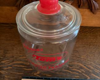 A207 - $55. Tom’s toasted peanuts jar. Measures 10.5 inches tall. In good, used shape. No chips or cracks seen.