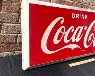 A34 - $275. Drink Coca-Cola Store Sign # 1 . Measures 40” x 16”.