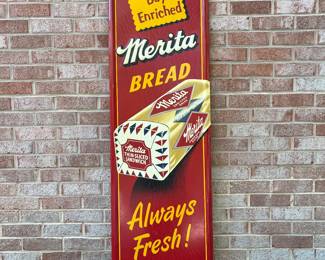 A64 - $1750. Merita Bread sign. Measures 54” by 18”. Bottom Right reads Stout Sign Co. St. Louis MO.