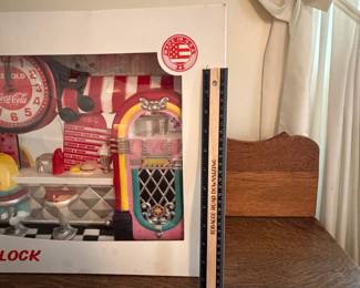 A215 - $40. Coca-Cola clock. still in box. Box measures 23 inches by 15 1/2 inches. In perfect shape. I’m