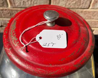 A79 - $80. Red topped Lance glass jar. Measures 12.5” tall. had some rubbed off paint and scratches on the lid.