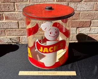 A73 - $65. 1950’s Jack’s 1 cent cookie jar. Measures 12" tall. Plastic with Metal Lid.