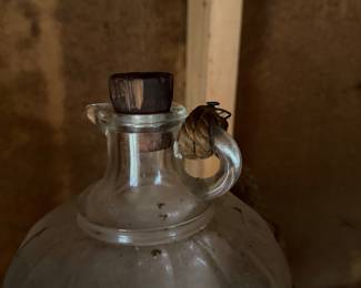 A229 - $30. 1 Gallon Glass Gasoline Bottle with wooden cork.