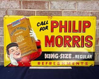 A13 - $550. Vintage Call for Philip Morris metal sign. Stout Sign Co. Measures 15” x 27”. The sign has some wear on the edges, and some scraped off paint. It has some rubbed off paint or rust right in the middle at the top of the sign.