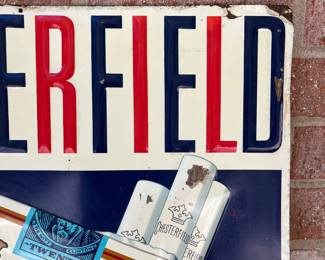 A4 - $250. Chesterfield cigarettes metal sign. Measures 19.25“ x 29“. Has minimal scratches on the paint and the corners have some damage.