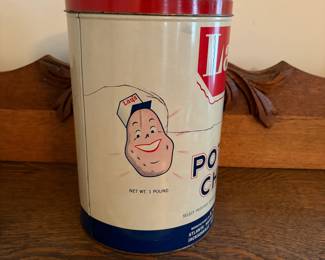 A208 - $50. Lays potato chips can. Measures 11.25 inches tall. It has some dents and scratches throughout.
