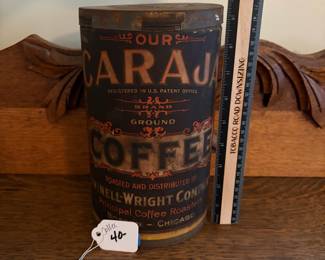 A204 - $40. Caraja Coffee Can. Measures 9.5 inches tall. Some rips on the paper label.