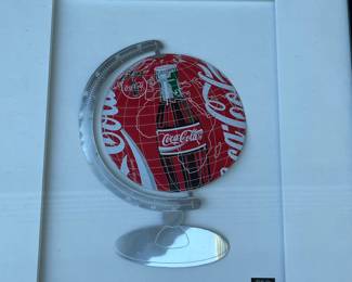 A32 - $80. Coca-Cola can art by Martin Allen. Measures 14” x 18”.