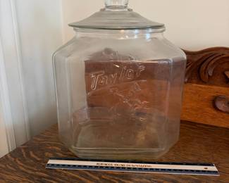 A202 - $115. Taylor “Taylored to taste.” Biscuit Jar. Measures 12” tall. Very minor chipping on the inside of the jar where the lid touches .