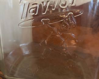 A202 - $115. Taylor “Taylored to taste.” Biscuit Jar. Measures 12” tall. Very minor chipping on the inside of the jar where the lid touches .