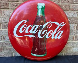A25 - $550. 1950s Coca-Cola Enameled Bubble Sign. Measures 24” diameter.