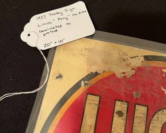 A191 - $300. Lucky Strike Cigarette Trolley Ad. Linus "Pony" McAtee. Sign has been laminated at some point to help protect it. Measures 20" x 10"