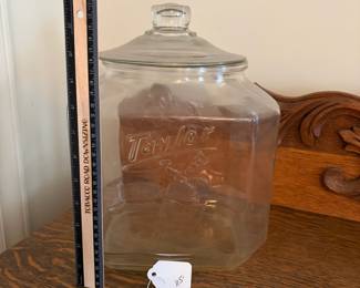 A202 - $115. Taylor “Taylored to taste.” Biscuit Jar. Measures 12” tall. Very minor chipping on the inside of the jar where the lid touches .
