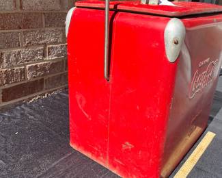 A42 - $100. Vintage Coca-Cola Cooler by Acton. Measures 17” x 12” x 19.5”. This has some wear and rubbed off paint and scratches. Handle works to lock it and has insert tray.