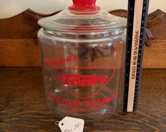 A207 - $55. Tom’s toasted peanuts jar. Measures 10.5 inches tall. In good, used shape. No chips or cracks seen.