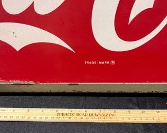 A34 - $275. Drink Coca-Cola Store Sign # 1 . Measures 40” x 16”.