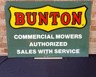 A63 - $100. Bunton Commercial Mowers Double-sided sign. Measures 36” x 24”.