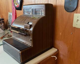 A177 - $100. 1950s Woodgrain Cash Register. Model 126(2). We have the key and the drawer opens.