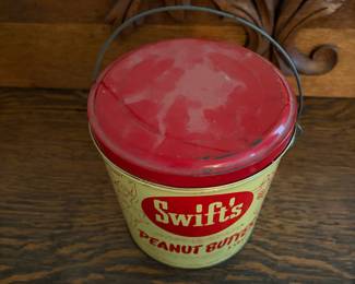 A203 - $20. Swift’s peanut butter 5 pound bucket. Measures 6.25 inches tall. Some dents and paint rubbed off. Otherwise good, used vintage shape.
