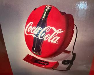A218 - $40. Coca-Cola disc telephone. Still in box. Brand new.