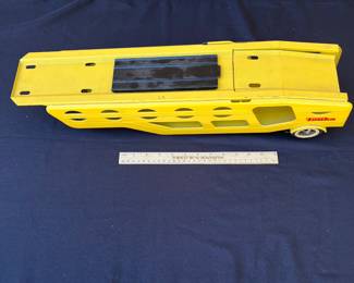 A98 - $160. 1960’s Tonka car carrier #40 with two rider cars. Measures measures 27.25” long.